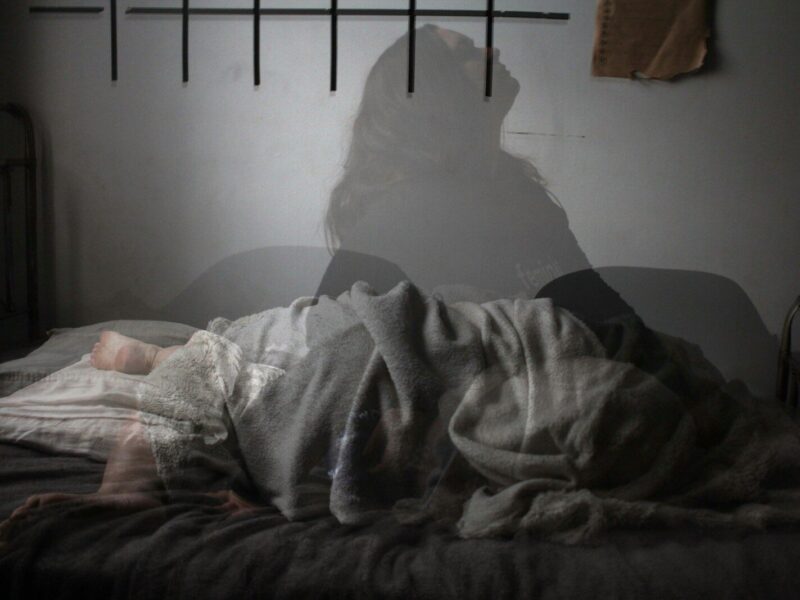shadow of woman on bed